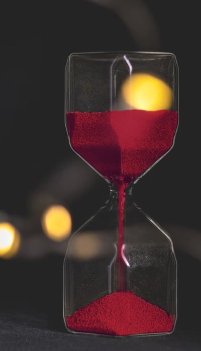 Hourglass with red sand